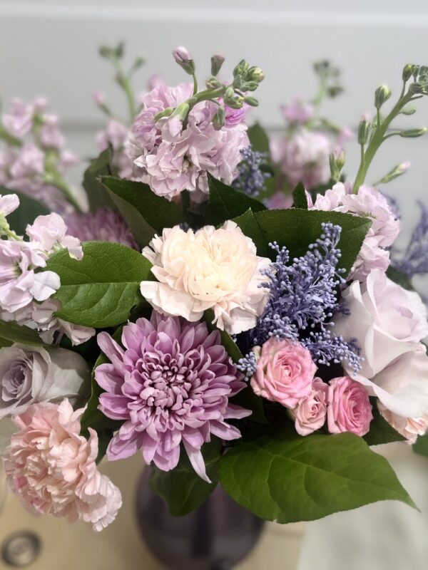"Purple Love", a medium sized flower bouquet with pastel flowers in purple and pink hues